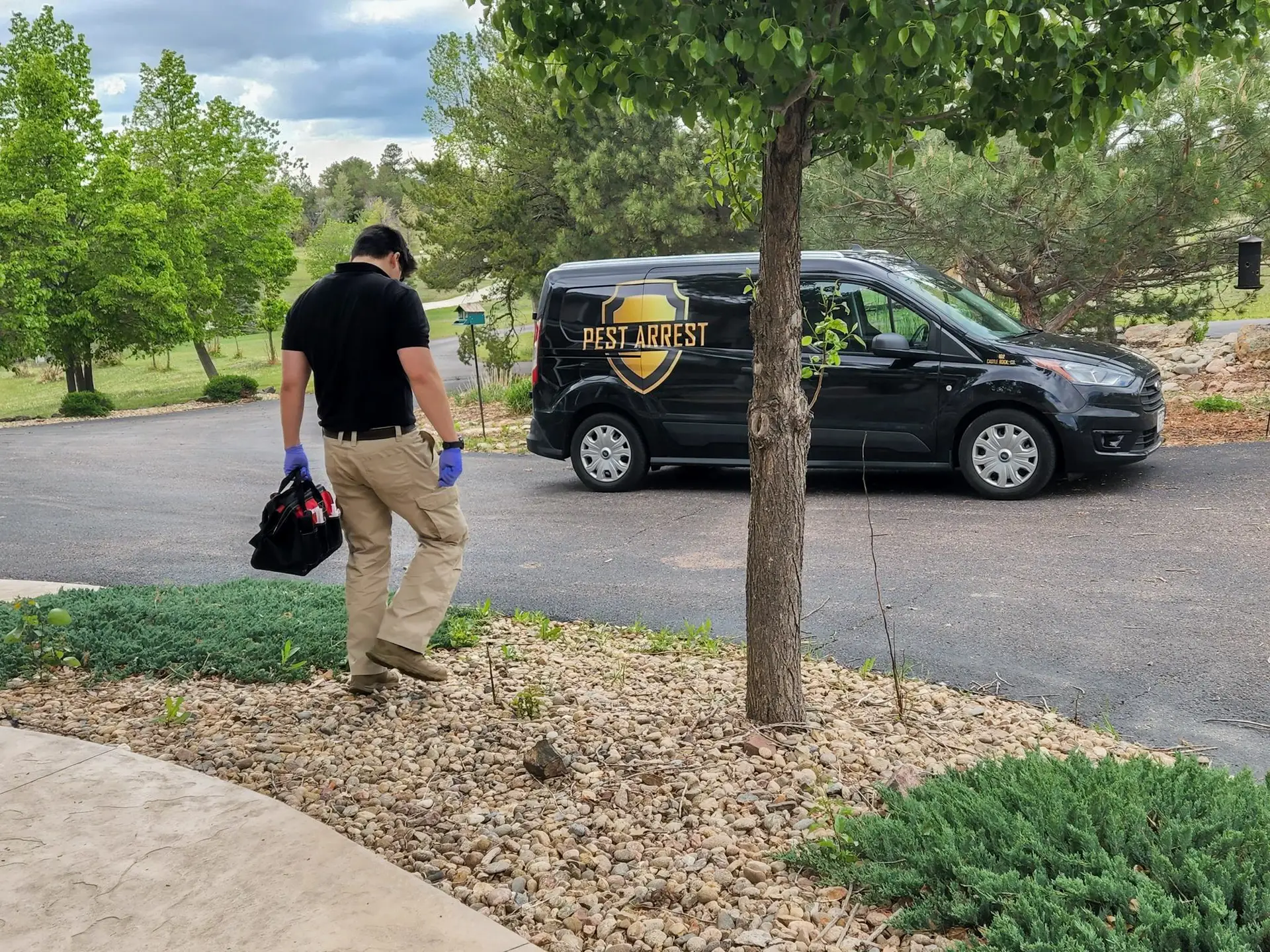 pest control professional and Pest Arrest truck